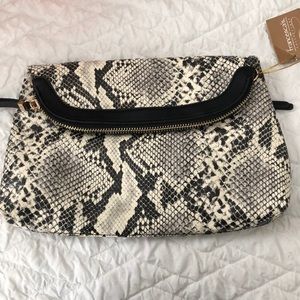 Clutch with strap inside